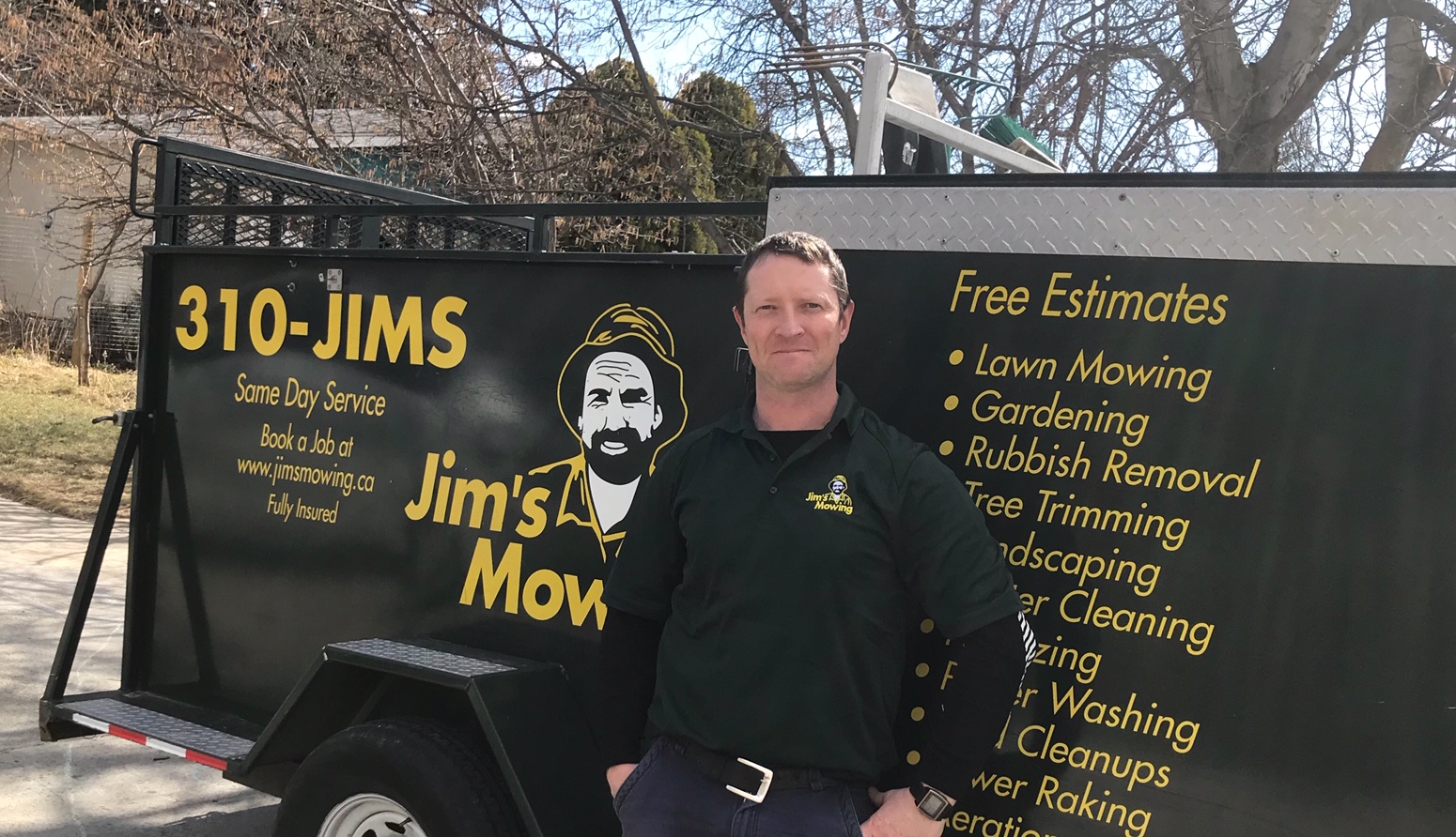 Kyle Deverill our Jim’s Mowing franchisee in Penticton, Naramata, Summerland, Kaledan and Okanagan Falls in front of his trailer