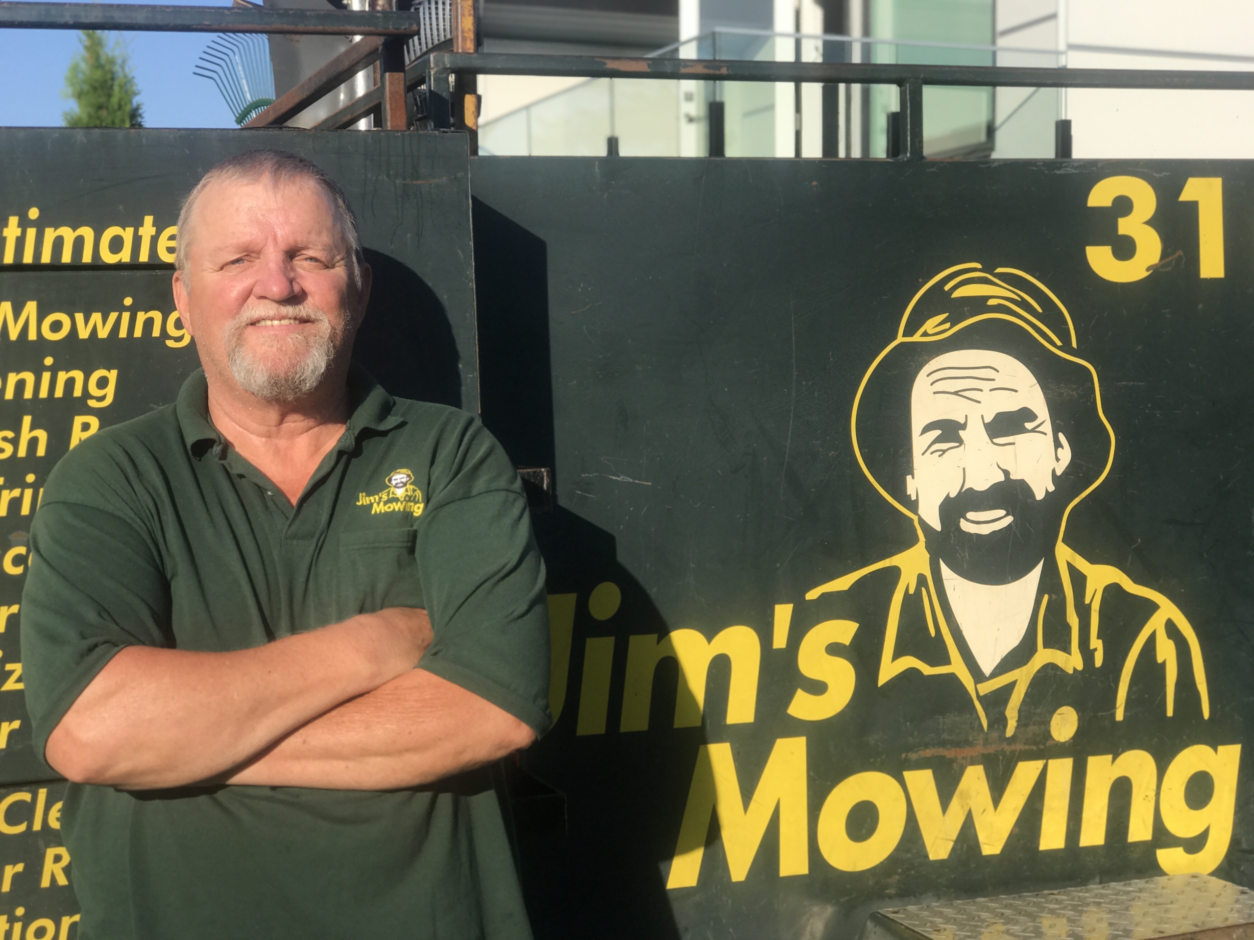 Stu Colcleugh our Jim’s Mowing franchisee in North and West Vancouver in front of trailer