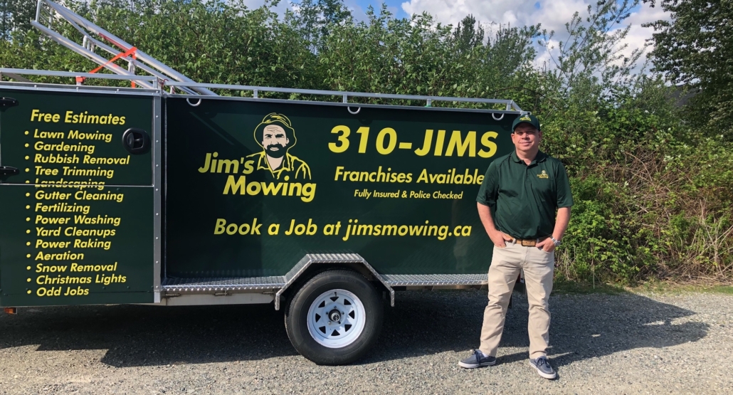 Aidan O'Connor our Jim’s Mowing franchisee in Langley in front of his trailer