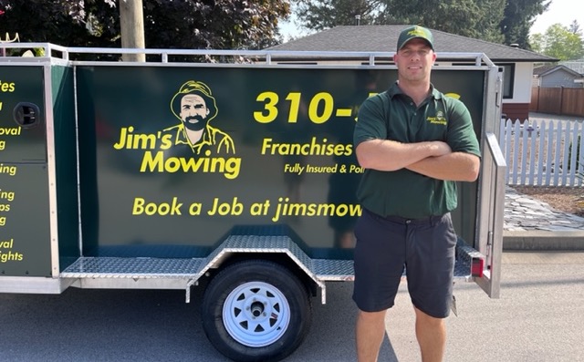 Craig Martin our Jim’s Mowing franchisee in Saltair, Ladysmith, Cinnibar, and South Nanaimo in front of trailer