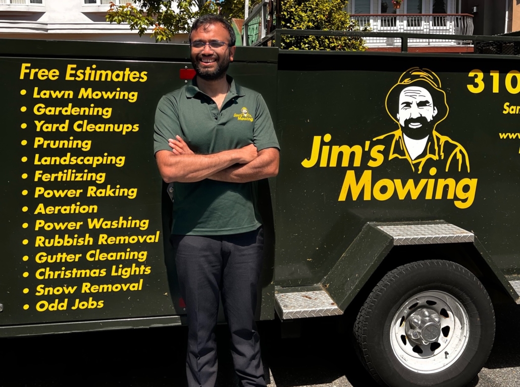 Mihir Doshi our Jim’s Mowing franchisee in Surrey in front of trailer