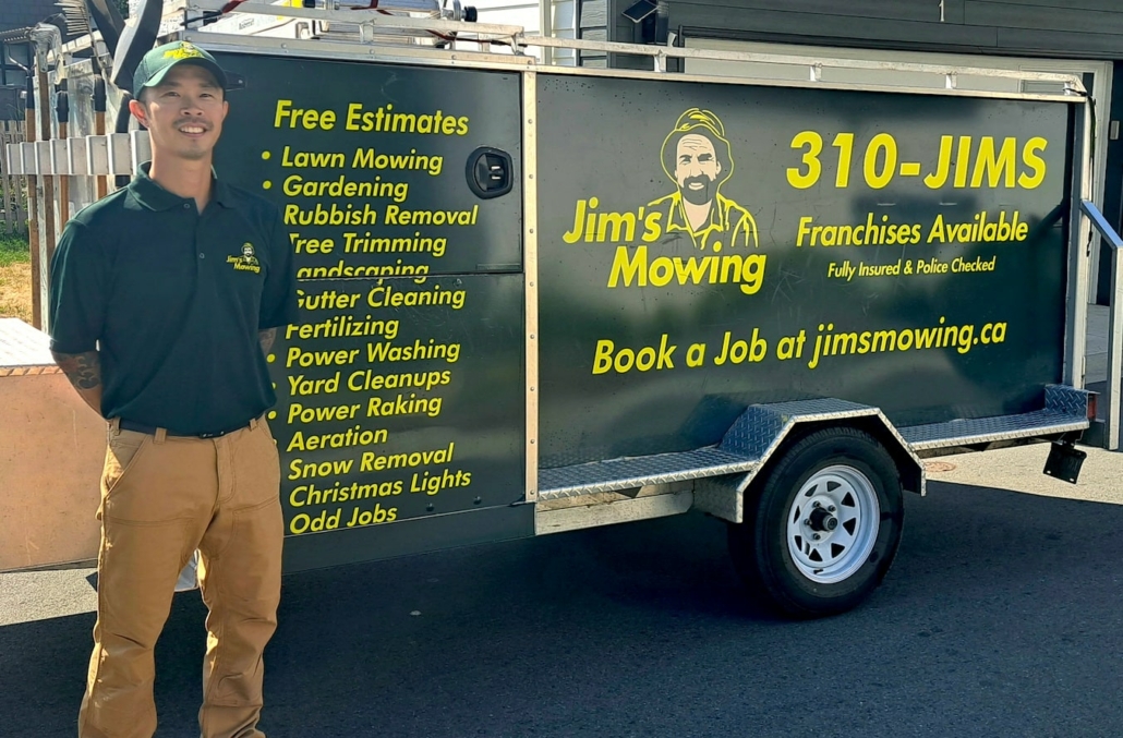 Keith Lung our Jim’s Mowing franchisee in Surrey in front of trailer
